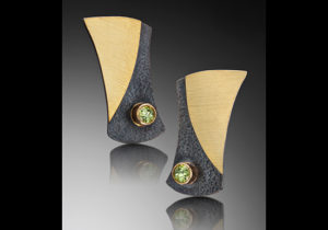 ER–11: Oxidized silver, 18k gold on silver, 14k gold, peridot 1.0 inch long by .75 inch wide. SOLD