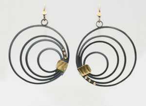 ER–66: Oxidized silver, 22 & 14k gold, 3 inches in diameter. $200.00 