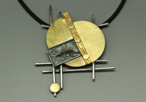 NKL-20- Reticulated oxidized silver with 18k gold granulation, 18K gold, 20 inch rubber cord, 3.35 inches by 3.0 inches. SOLD