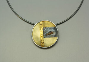 NKL–8: Oxidized reticulated silver, 22k, 18k gold, on 16 inch omega chain, pendant.