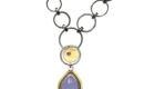 NKL–174: Oxidized sterling silver. 24k gold, Namibian Blue Chalcedony, Tanzanite. Pendant. 3"x1" Adjustable chain sold separately.Oxidized sterling silver, 